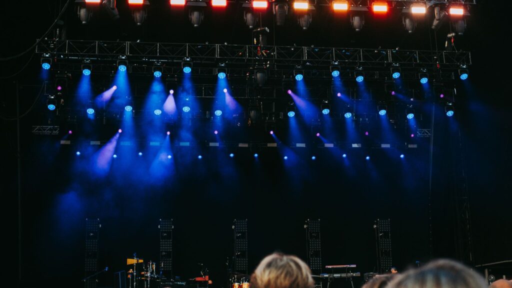 Music festival crowd at night — TravelDeals AI