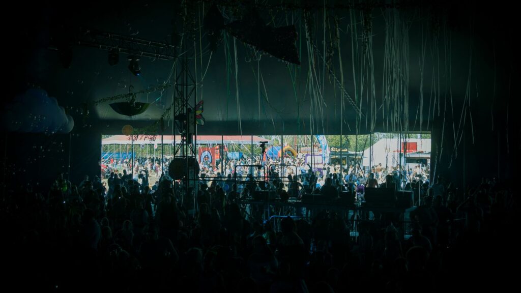 Open-air music festival crowd — TravelDeals AI