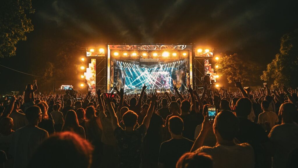 Open-air rock festival crowd — TravelDeals AI