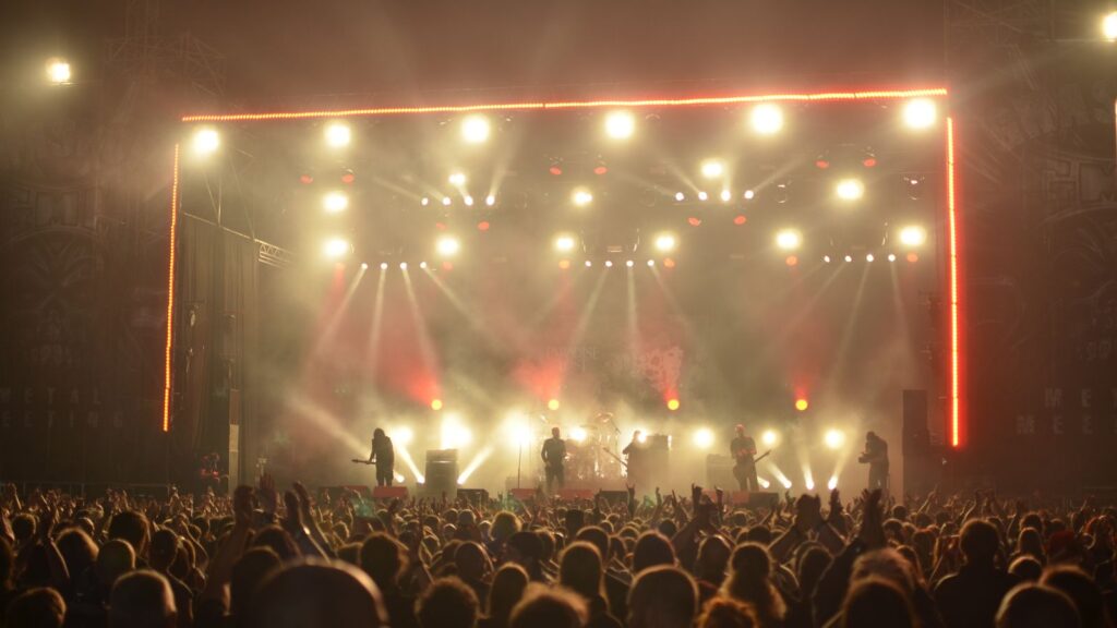 Rock festival crowd at night — TravelDeals AI
