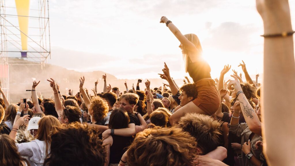 Festival crowd at sunset — TravelDeals AI