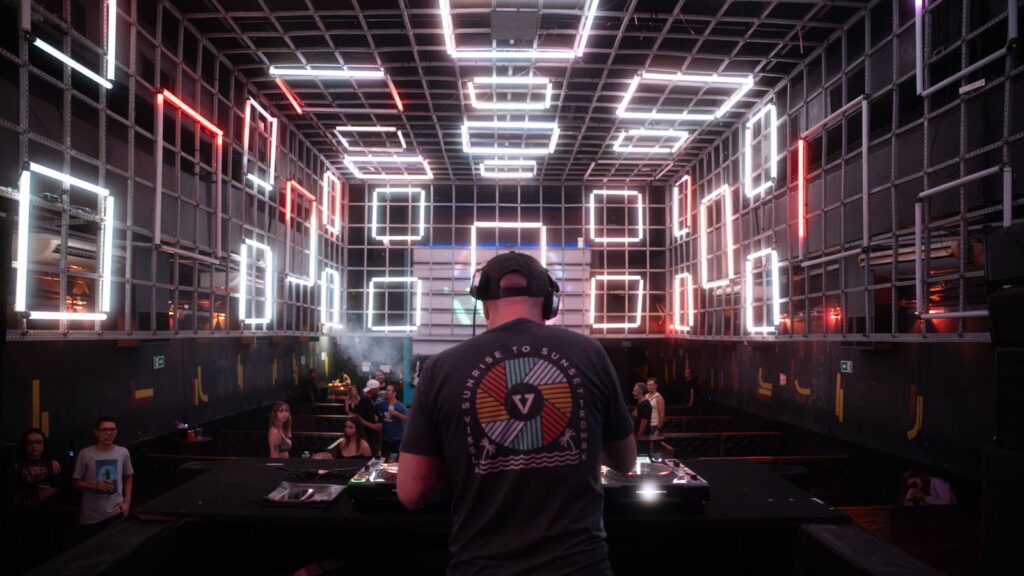 Techno club crowd with neon lights — TravelDeals AI